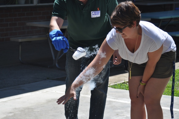     I pour a cup of liquid nitrogen over Amanda’s arm while she looks on in terror. Don't worry, she was fine afterwards!
